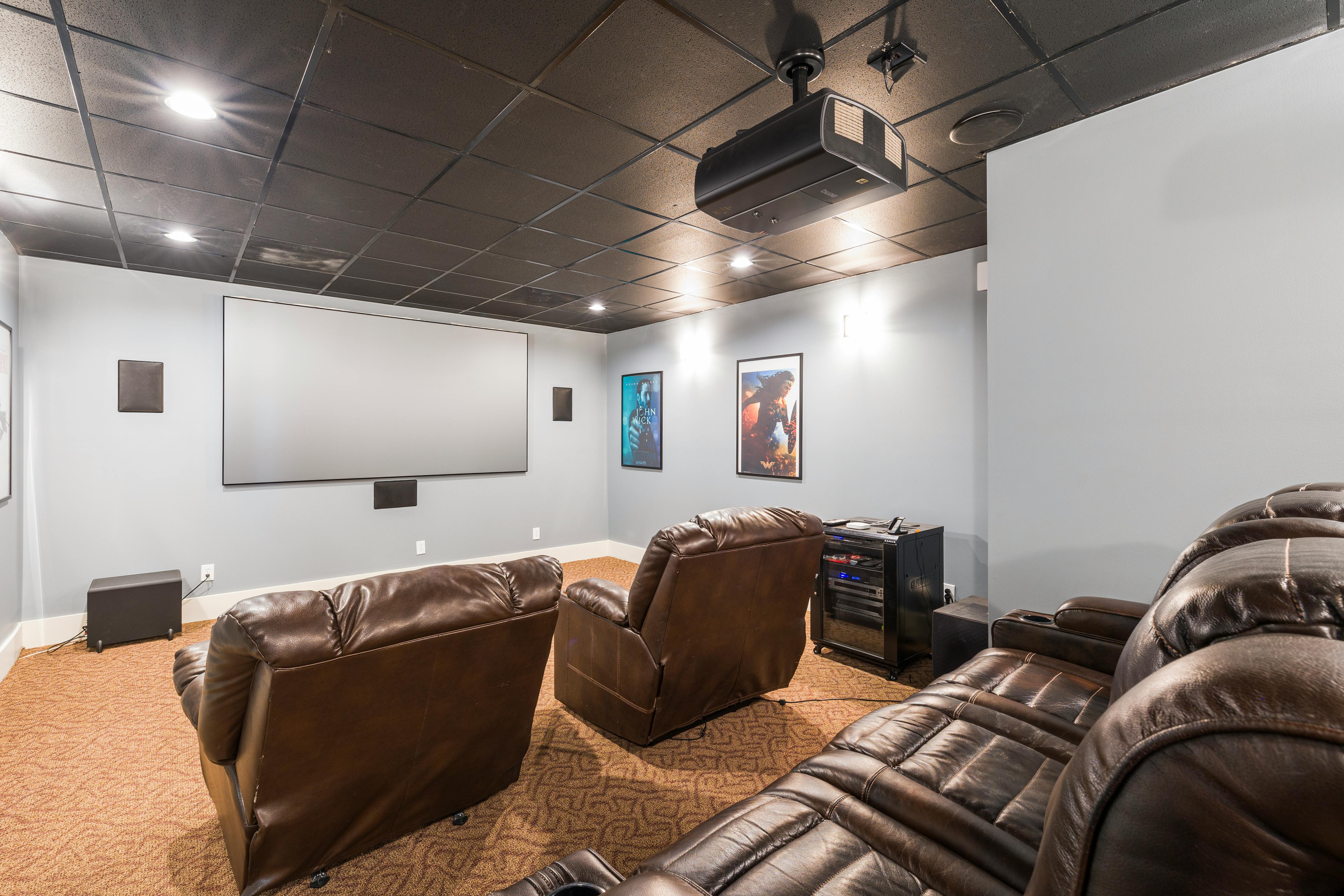Wall-mounted television and home theater system setup in a living room